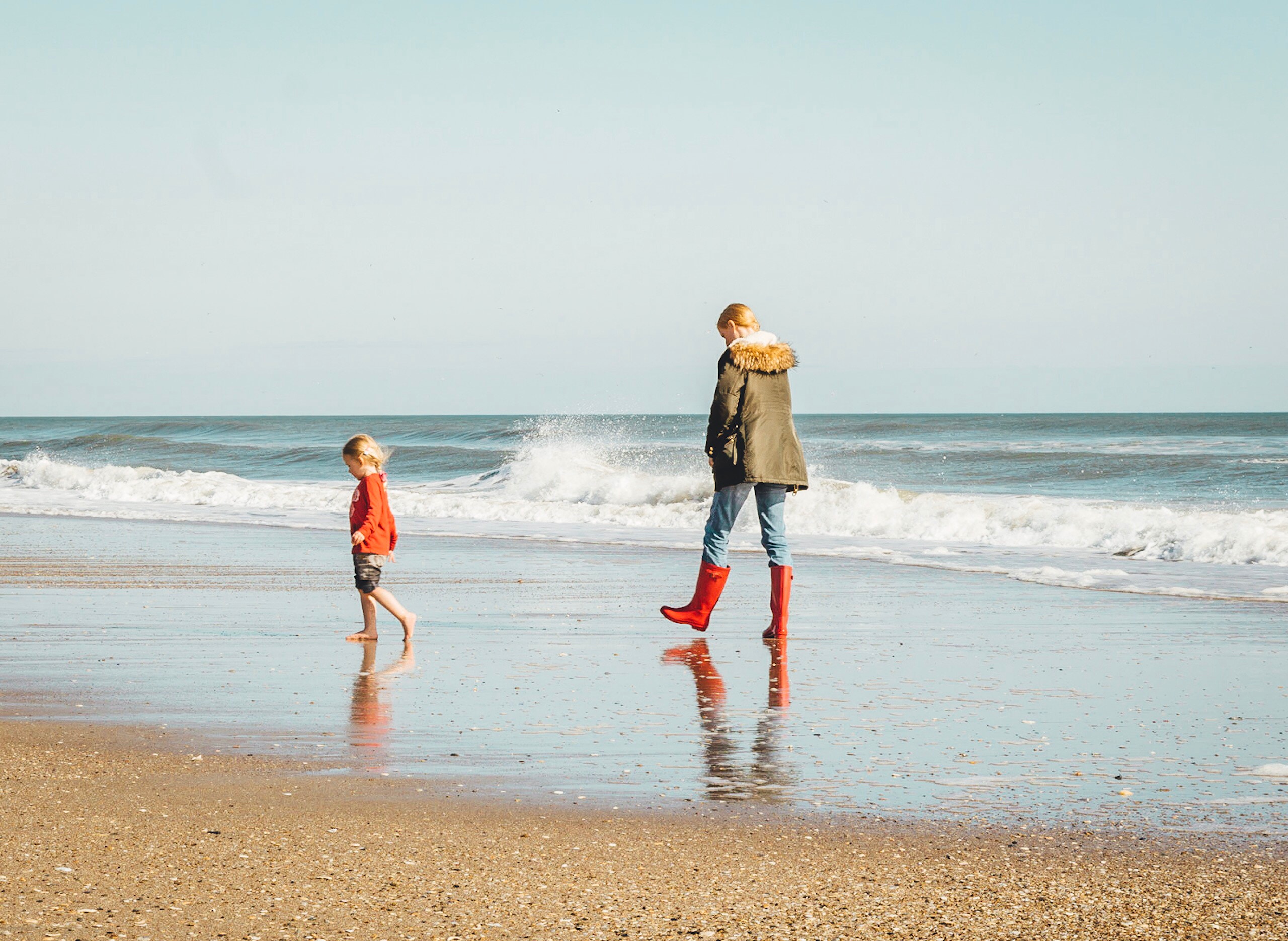 Woman and child on beach banner