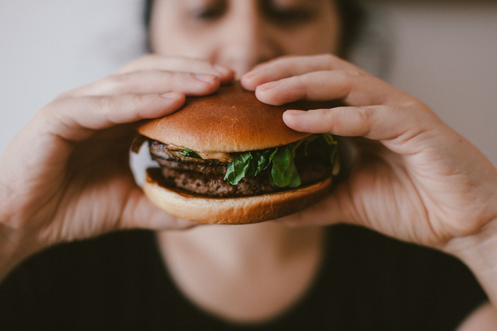 Person eating burger