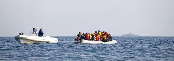 Migrant boat being towed